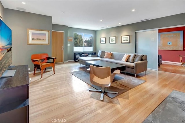 living room with light hardwood / wood-style floors