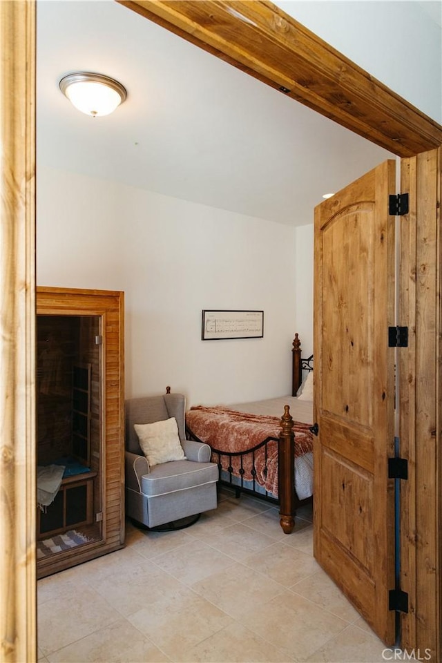 bedroom featuring light tile patterned flooring