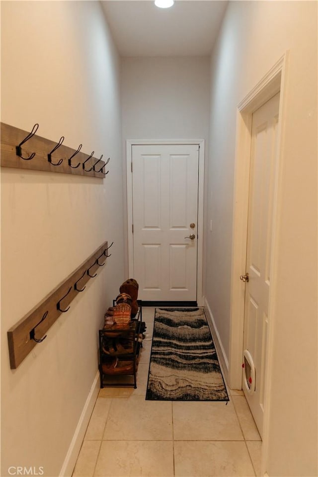 doorway featuring light tile patterned floors