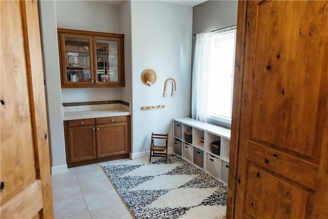 mudroom with light tile patterned floors