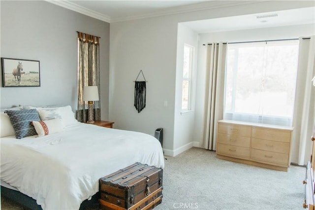 carpeted bedroom featuring multiple windows and crown molding