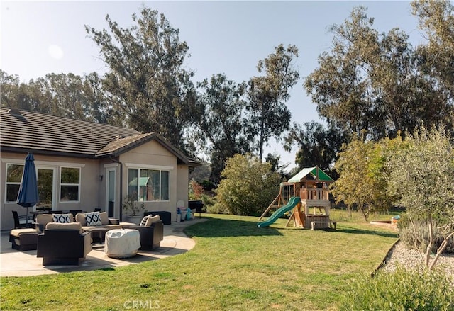 view of yard with an outdoor hangout area, a playground, and a patio area