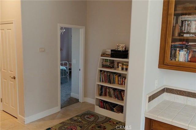 corridor with light tile patterned floors