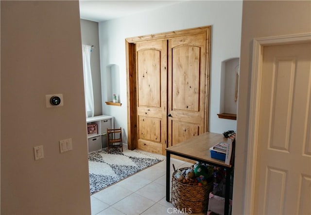 interior space with light tile patterned floors