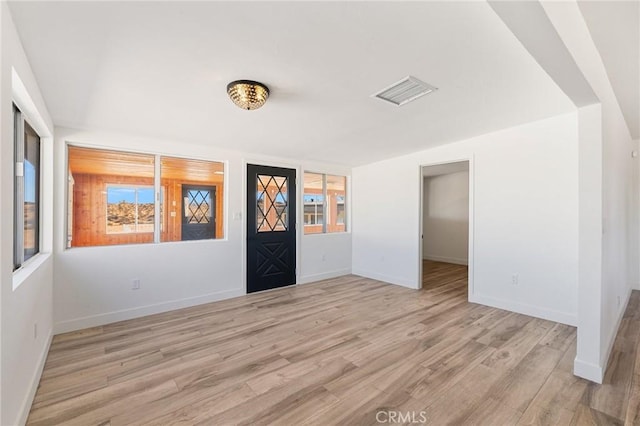 foyer entrance with light wood-type flooring