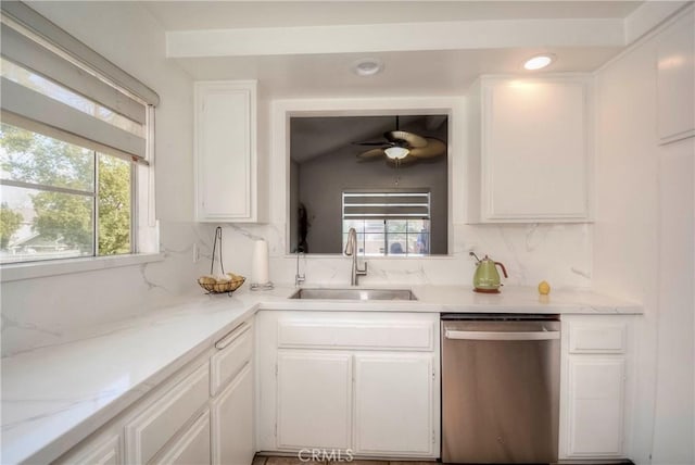 kitchen featuring dishwasher, white cabinetry, decorative backsplash, sink, and ceiling fan