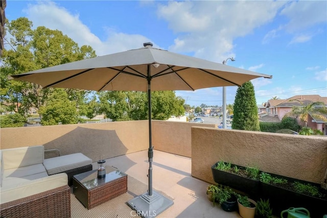 view of patio with an outdoor living space and a balcony