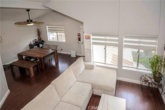 living room with ceiling fan, vaulted ceiling, and dark hardwood / wood-style flooring