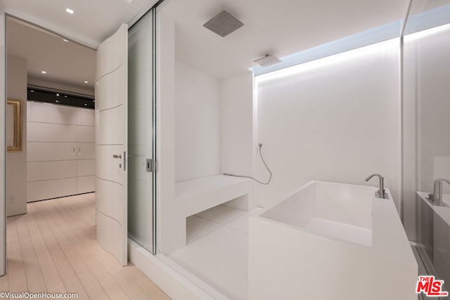 bathroom featuring hardwood / wood-style flooring