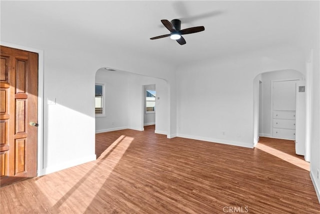 unfurnished living room featuring hardwood / wood-style flooring and ceiling fan