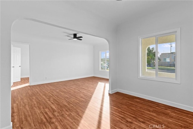 spare room featuring hardwood / wood-style floors and ceiling fan