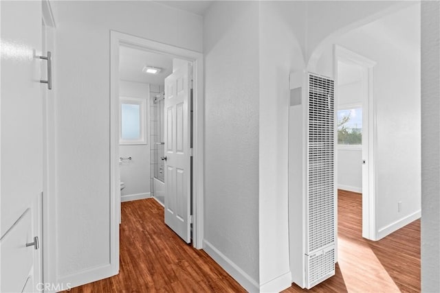 hallway featuring wood-type flooring