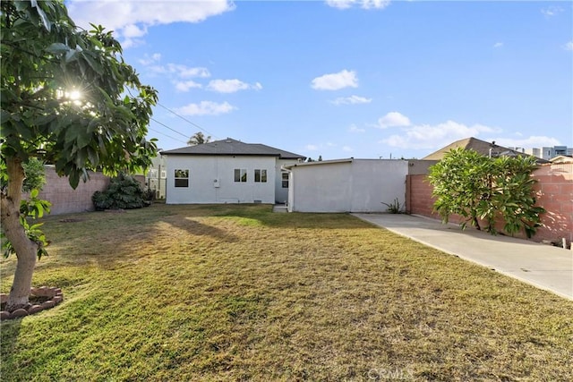 exterior space featuring a patio and a front lawn