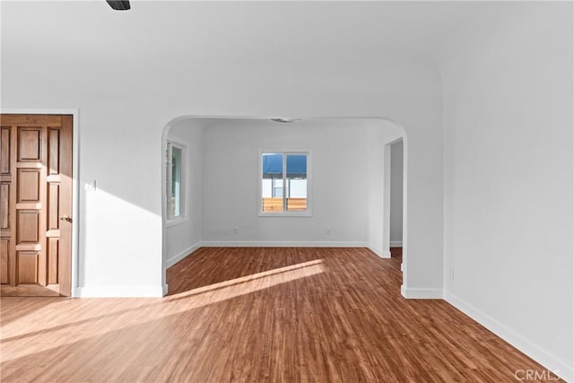 unfurnished room featuring hardwood / wood-style flooring