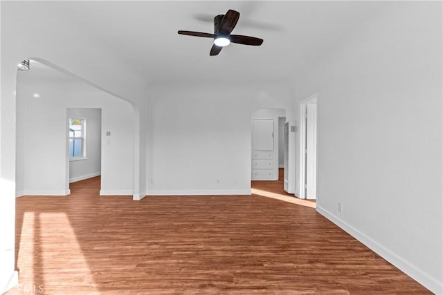 unfurnished living room featuring wood-type flooring and ceiling fan