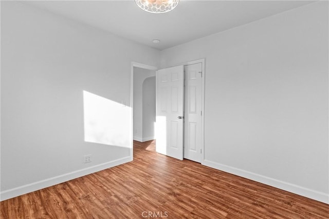 spare room featuring hardwood / wood-style floors