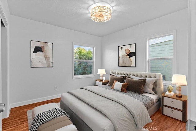 bedroom with light wood-type flooring