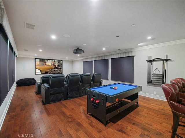 cinema room featuring billiards, hardwood / wood-style floors, and crown molding