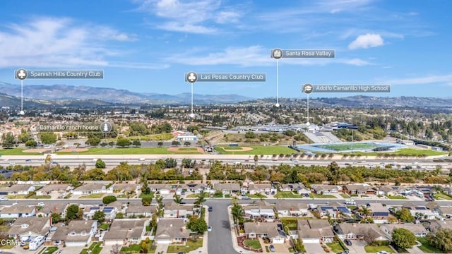 drone / aerial view with a residential view and a mountain view