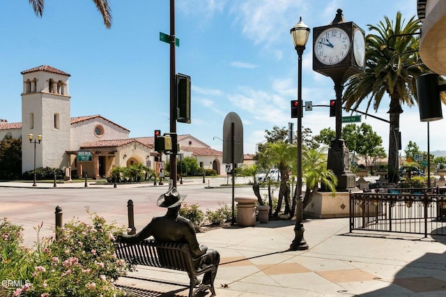 view of property's community featuring fence
