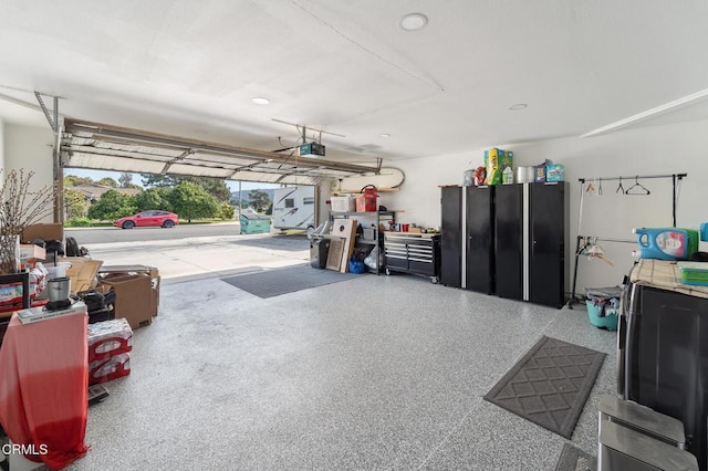 garage featuring recessed lighting and a garage door opener