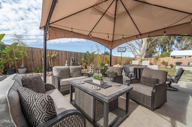 view of patio / terrace featuring outdoor lounge area and a fenced backyard