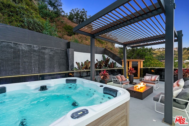 view of pool with a hot tub, a pergola, and an outdoor living space with a fire pit