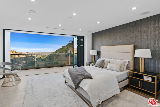 bedroom with light hardwood / wood-style flooring