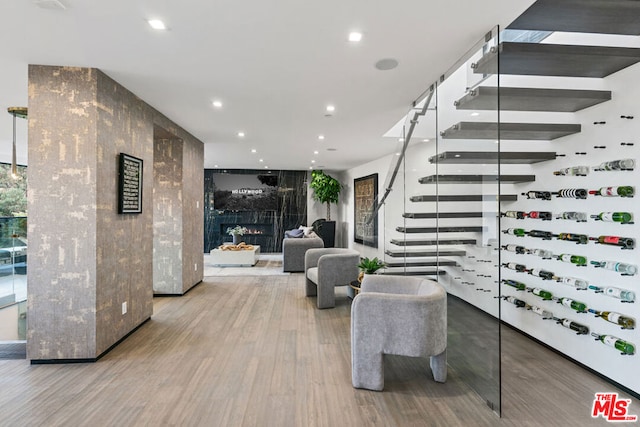 interior space featuring a premium fireplace and light hardwood / wood-style floors