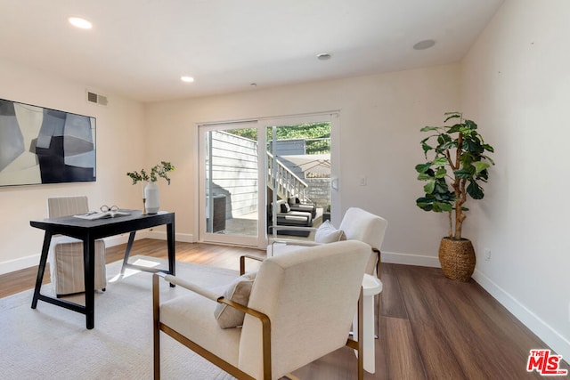 home office with wood-type flooring