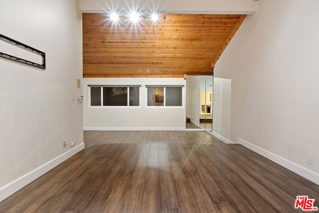 spare room featuring wooden ceiling, dark hardwood / wood-style flooring, and high vaulted ceiling