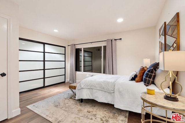 bedroom featuring hardwood / wood-style floors