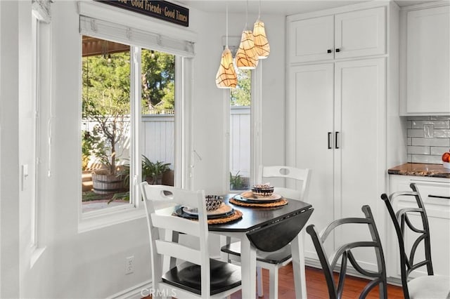 dining area with wood-type flooring