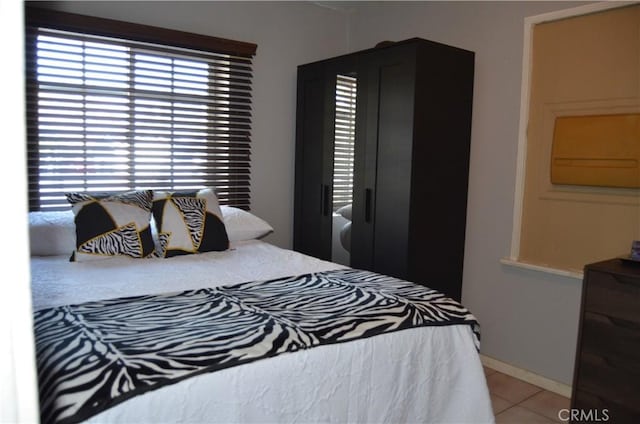 bedroom with light tile patterned flooring