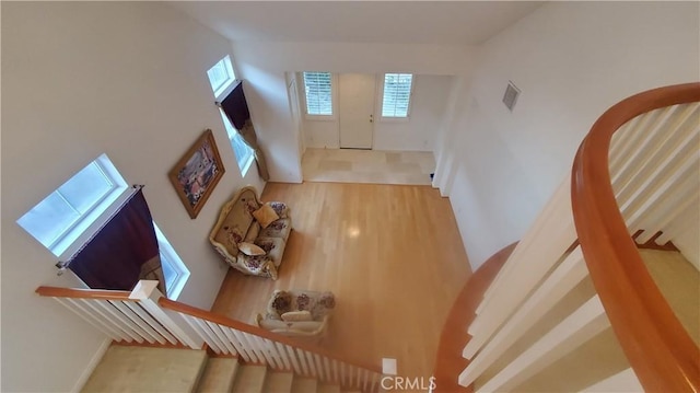 interior space featuring a high ceiling and a wealth of natural light