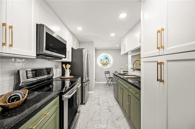 kitchen featuring sink, white cabinetry, green cabinets, and stainless steel appliances