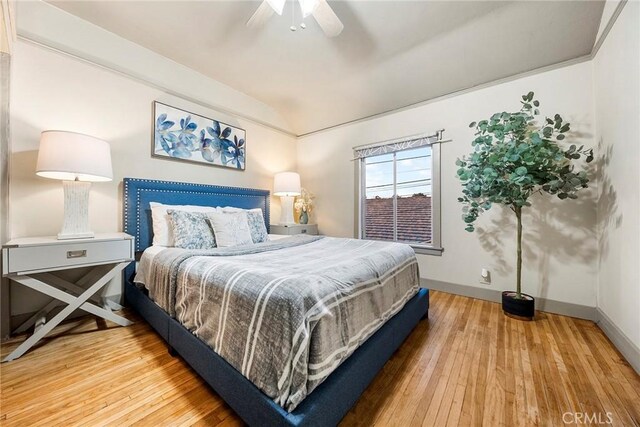 bedroom with ceiling fan and wood-type flooring