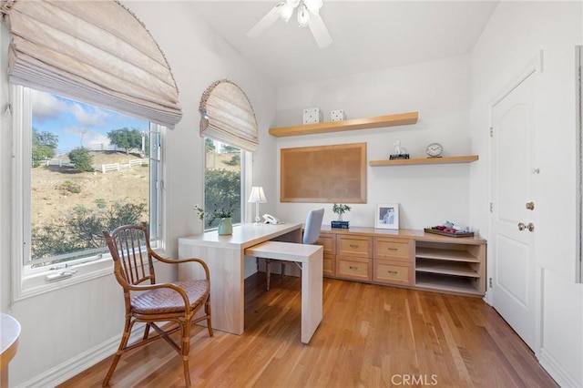 home office with ceiling fan and light wood-type flooring