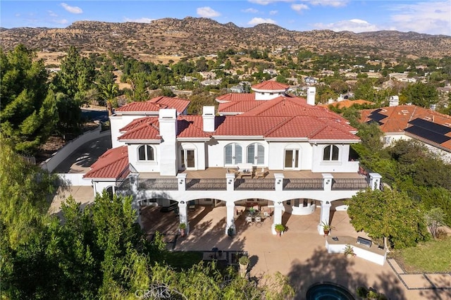 birds eye view of property with a mountain view