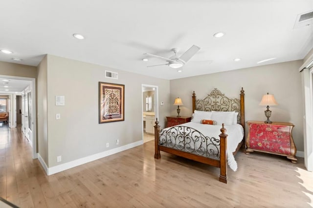 bedroom with light wood-type flooring, connected bathroom, and ceiling fan