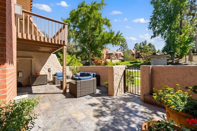 view of patio / terrace with a balcony and outdoor lounge area