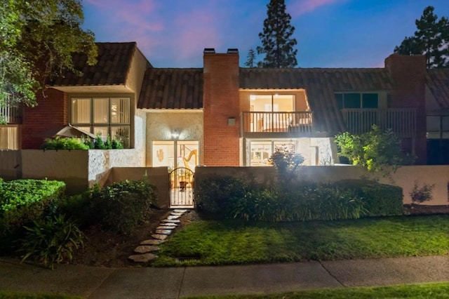 view of front of home with a balcony