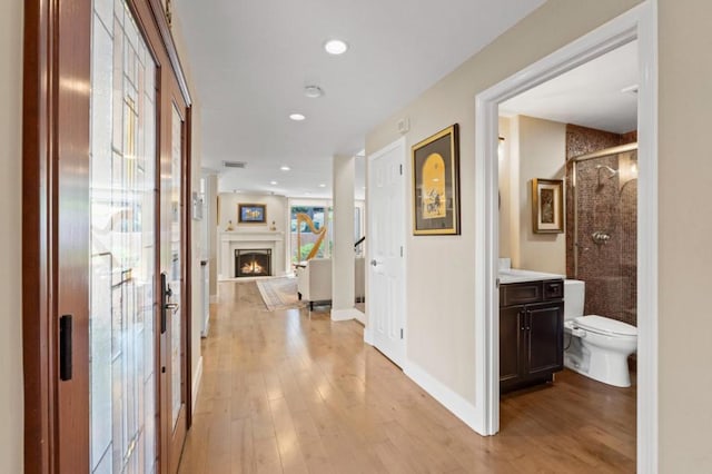 corridor featuring light wood-type flooring