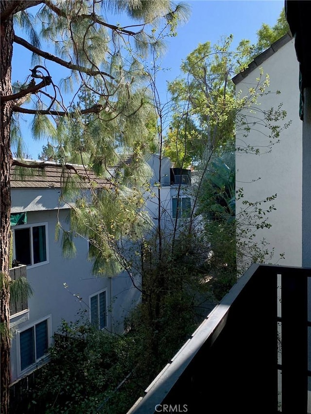 view of property exterior with a balcony