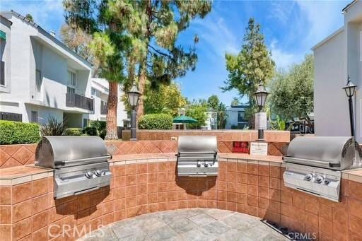 view of patio featuring grilling area and an outdoor kitchen