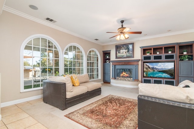 19490 Calle Juanito, Murrieta, CA 92562 - tiled living area featuring a glass covered fireplace, ornamental molding, a ceiling fan, and baseboards