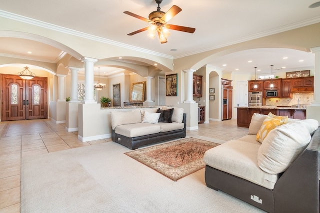 19490 Calle Juanito, Murrieta, CA 92562 - living room with ornate columns, light tile patterned floors, a ceiling fan, baseboards, and ornamental molding