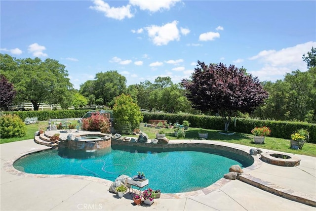 19490 Calle Juanito, Murrieta, CA 92562 - view of pool featuring a patio area, a lawn, an outdoor fire pit, and a pool with connected hot tub
