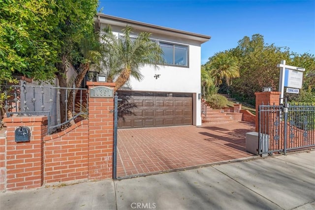 view of gate featuring a garage