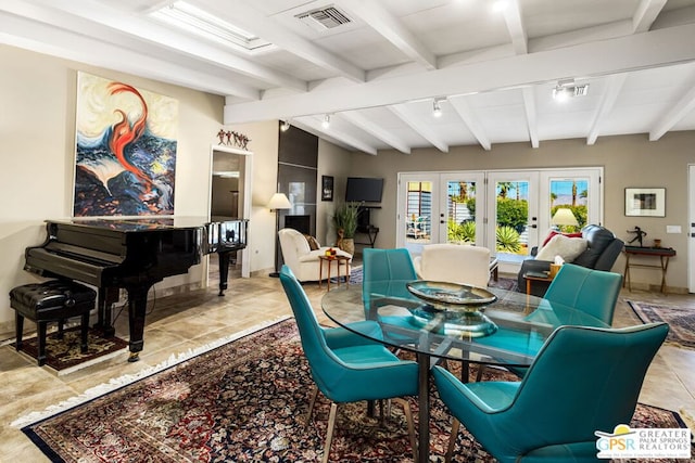 dining space featuring track lighting, french doors, and beamed ceiling